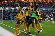 BURNLEY, ENGLAND - OCTOBER 02:  Arsenal players celebrate Alex Oxlade-Chamberlain of Arsenal goal during the Premier League match between Burnley and Arsenal at Turf Moor on October 2, 2016 in Burnley, England.  (Photo by Matthew Lewis/Getty Images)